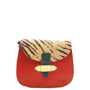 Handcrafted crossbody shoulder bag made from 100% recycled leather with reversible flap in red, yellow, blue, and animal print tones, featuring dual zip compartments and adjustable leather strap, eco-friendly saddle bag for women