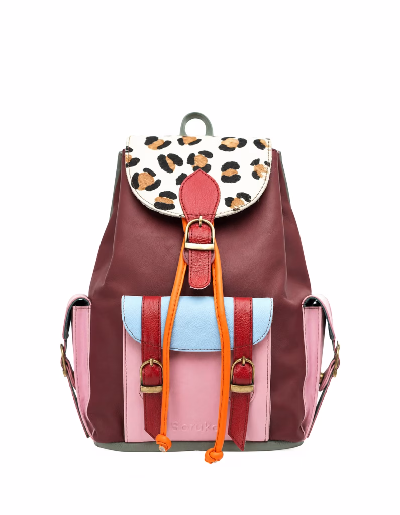 Women’s recycled leather backpack in xxxxx tones with animal print flap and adjustable leather straps