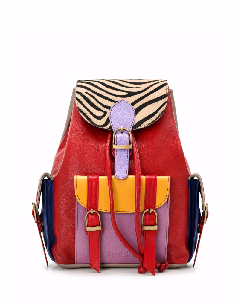 Women’s recycled leather backpack in Red tones with animal print flap and adjustable leather straps