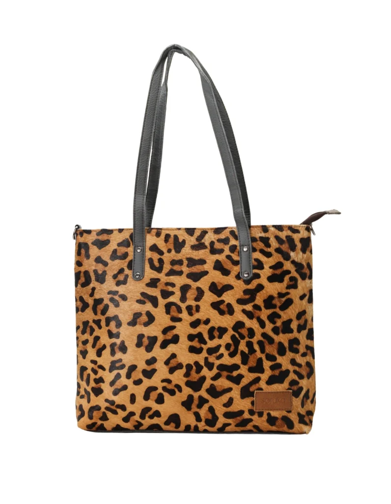Women’s recycled leather tote shoulder bag with reversible animal print design and adjustable crossbody strap