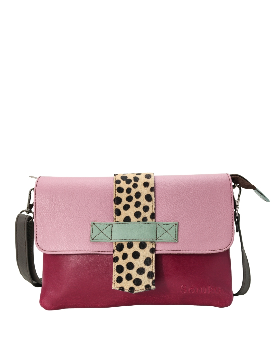 Women’s recycled leather crossbody bag in Pink and Purple with reversible design