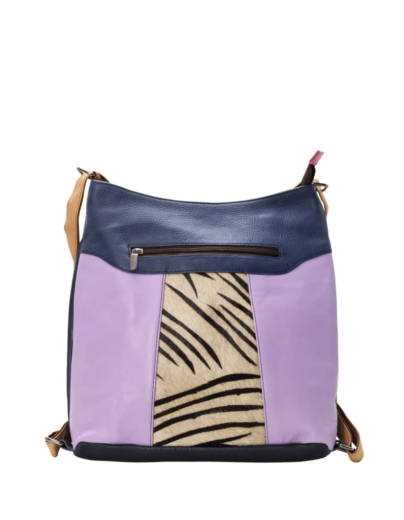 Handmade recycled leather convertible backpack in purple and blue tones with animal print and adjustable strap