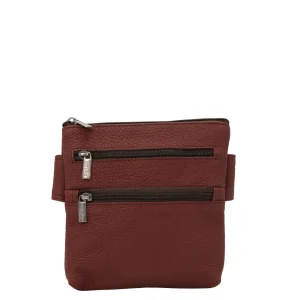 Handmade recycled leather belt bag in Red tones with four zip compartments and adjustable strap